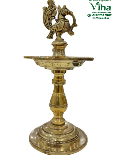 Brass annapakshi kuthuvilakku, swan finial above a flat circular oil dish on a turned stem and stepped base