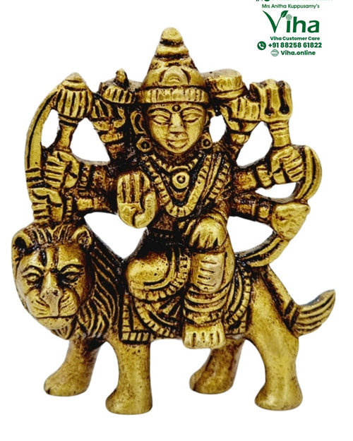 Maa Durga in brass, many-armed figure seated on a lion with a tall crown