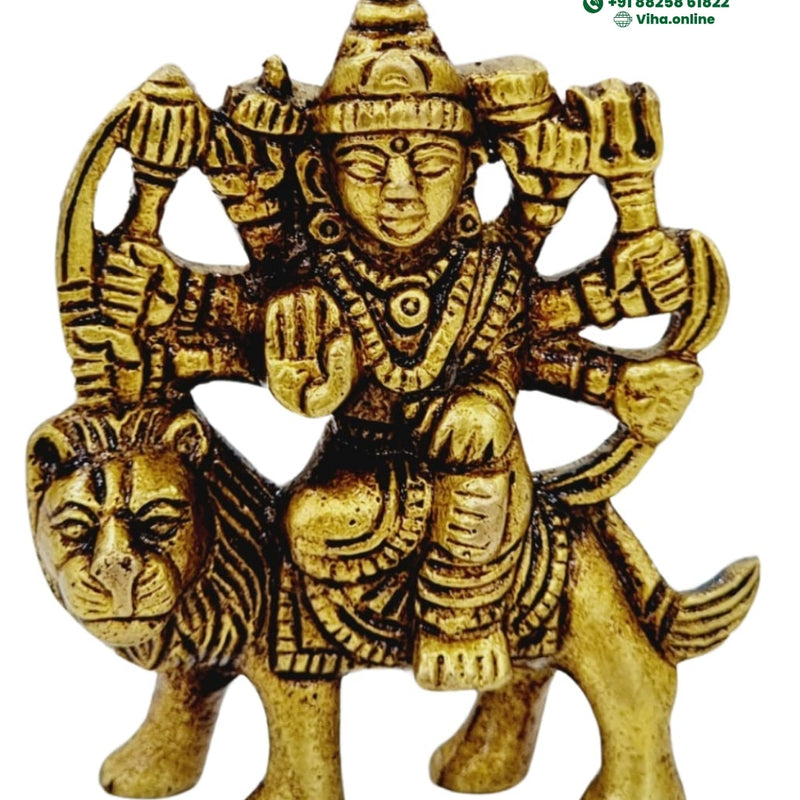Maa Durga in brass, many-armed figure seated on a lion with a tall crown