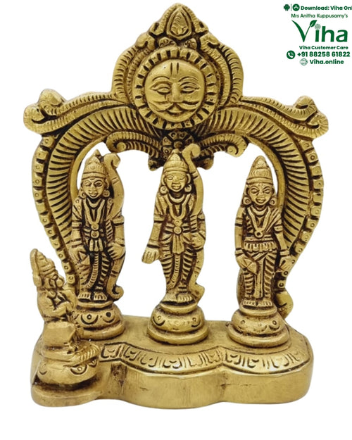 Ram Darbar in brass, three standing figures beneath an arch topped with a sun face, a kneeling figure at the base