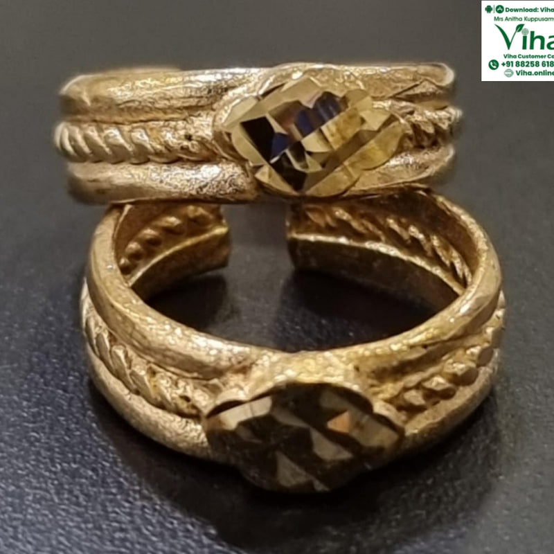 Impon Toe Ring, two gold-toned textured rings with braided details and a central faceted stone are stacked vertically on a dark surface