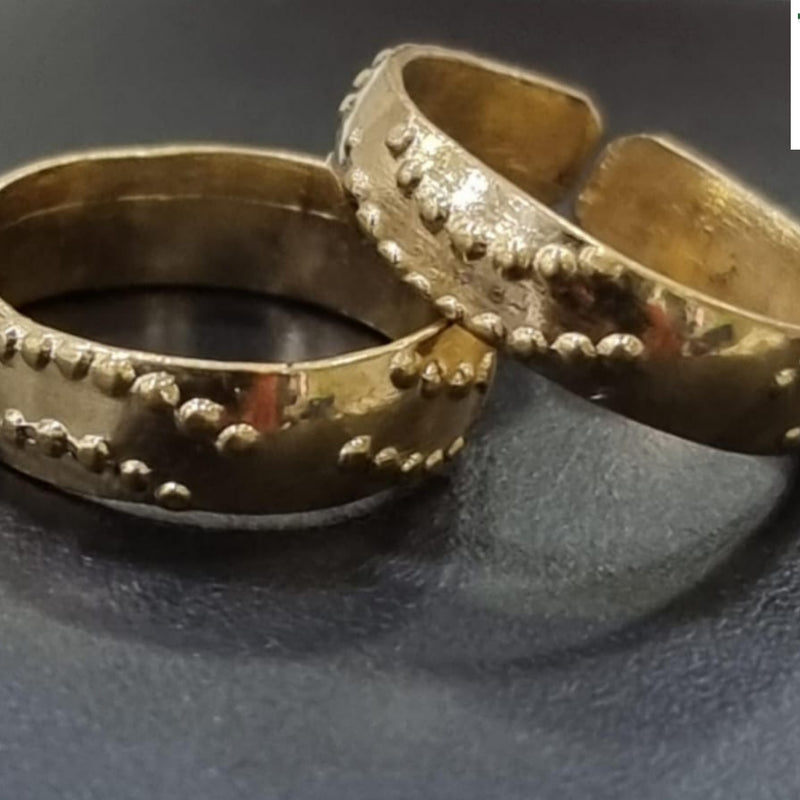 Impon Toe Ring with an open band and raised dotted edges