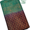 Soft Silk Saree with Stone Work, a folded fabric with green upper section and dark brown lower section featuring gold-toned floral patterns and diamond lattice