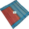 Soft Silk Saree With Blouse, a folded fabric with an orange-red section and blue patterned sections featuring ornate metallic borders