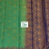 Soft Silk Saree With Blouse, a green textile with repeating gold-toned motifs and a wide blue patterned border with gold-toned designs