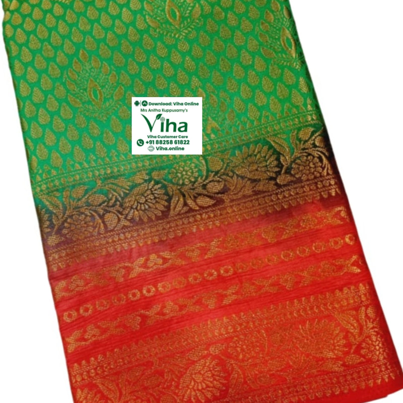 Soft Silk Saree With Blouse, a folded green and red textile piece featuring gold-toned woven patterns with leafy motifs and floral borders