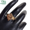 Impon Ring with Vel, a gold-toned metal ring featuring an engraved face with symbol details rests on a black mannequin hand
