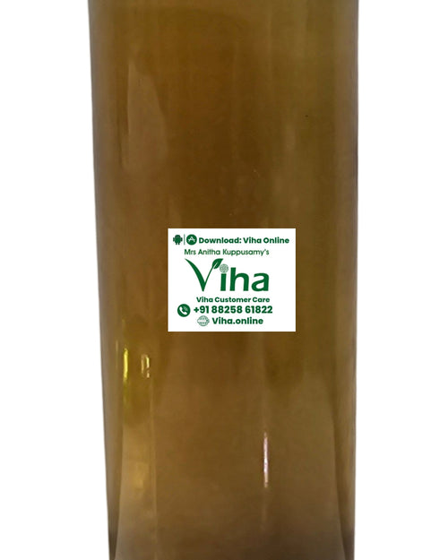 Nannari Syrup in a translucent plastic bottle with amber liquid inside