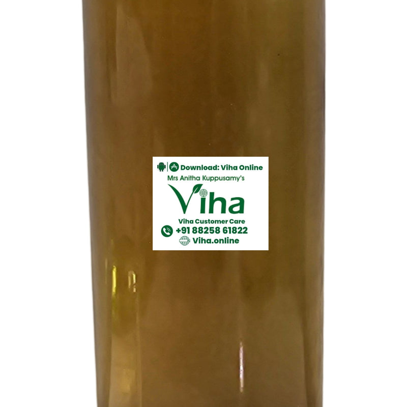 Nannari Syrup in a translucent plastic bottle with amber liquid inside