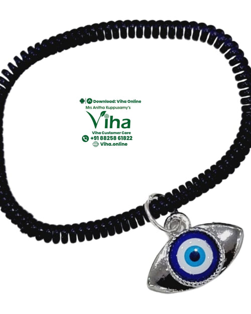 Eye Shape Evil Eye Anklet, a dark shiny spiral band with a silver-toned eye pendant featuring blue, white, and black concentric circles hanging from a ring