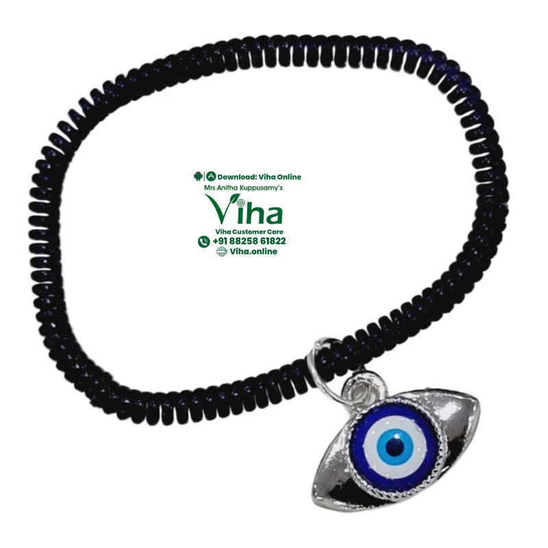 Eye Shape Evil Eye Anklet, a dark shiny spiral band with a silver-toned eye pendant featuring blue, white, and black concentric circles hanging from a ring