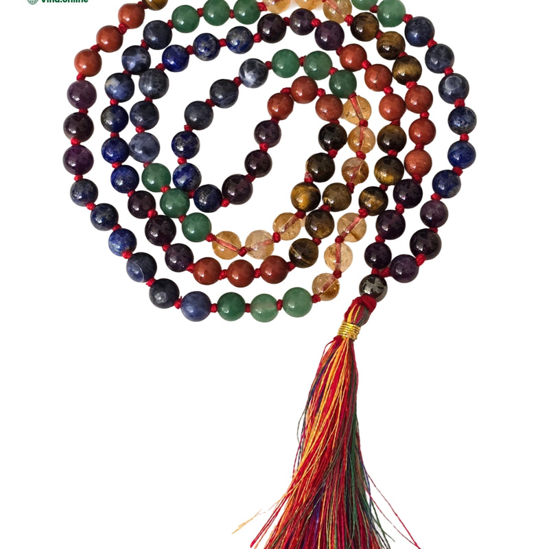 7 Chakra Stone Mala - 108+1 Beads, a coiled strand of beads ending in a tassel