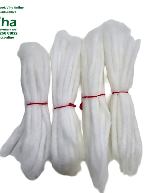Four bundles of white cotton lamp wick, each tied with red thread