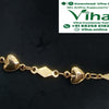 Impon Anklets, a gold-toned chain features alternating rhombus and heart-shaped glossy links against a dark background