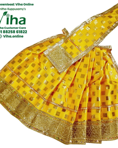 Amman Pavadai Set, a yellow garment patterned with shiny gold-toned squares, featuring wide metallic gold-toned borders and a pleated skirt construction