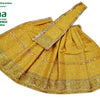 Amman Pavadai Set, a yellow fabric garment with a shiny gold-toned patterned border and a diagonal sash across the pleated body