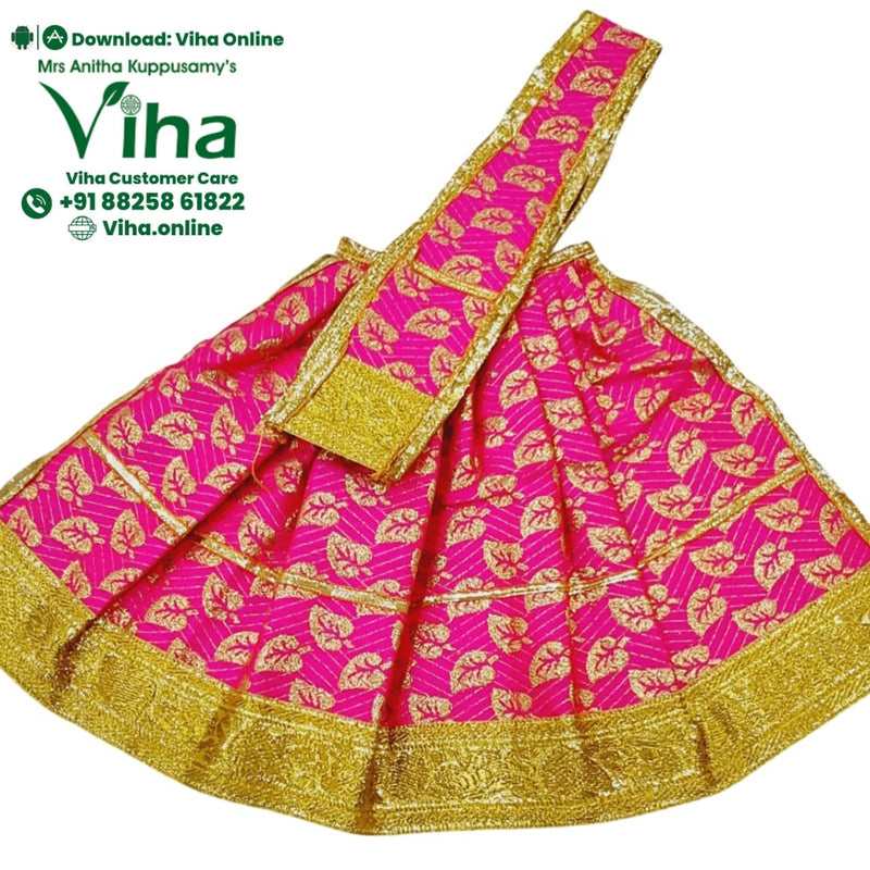 Amman Pavadai Set, a flared pink garment with shiny gold-toned leaf patterns and a glossy, textured border includes one long diagonally placed matching sash