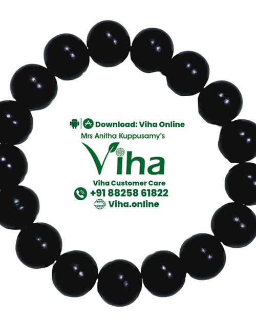 Karungali Bracelet, a round bracelet of eighteen glossy black beads with green text beneath it on a white background