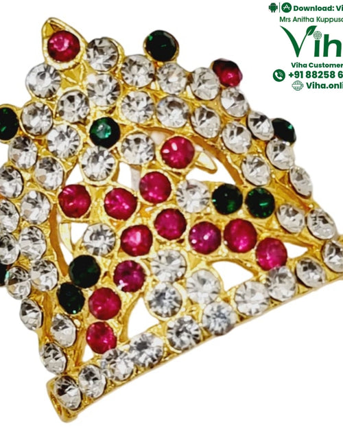 Crown for God & Goddess, a gold-toned ornament with clear, red, and dark green stones embedded