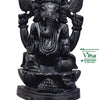 Karungali Ganesha, seated four-armed elephant-headed figure carved in black karungali wood, trunk curved to a bowl