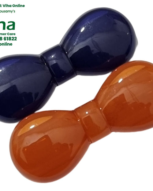 Pair of glossy bow-shaped saree pins in dark blue and orange