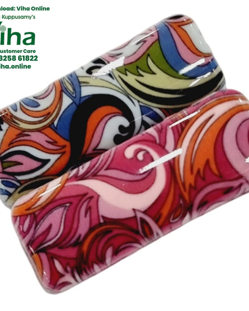 Saree Pin Set Floral Design, two rectangular pins with a white and blue floral swirl print and a pink floral swirl print