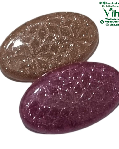 Saree Pin Set, two glossy oval cabochons, one brown with gold-toned sparkle, one purple with white sparkle
