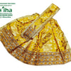 Amman Pavadai Set, a yellow fabric garment with shiny gold-toned floral patterns and a wide, heavily embellished border trim along the lower edge