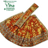 Amman Pavadai Set, an orange pleated textile garment featuring shiny gold-toned floral patterns and a metallic gold-toned striped border