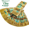 Amman Pavadai Set, a gold-toned and turquoise patterned fabric garment with scalloped borders and a brown braided trim overlay
