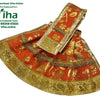 Amman Pavadai Set, an orange fabric garment with a gold-toned metallic pattern, featuring a flared skirt and an attached sash with fringe trim