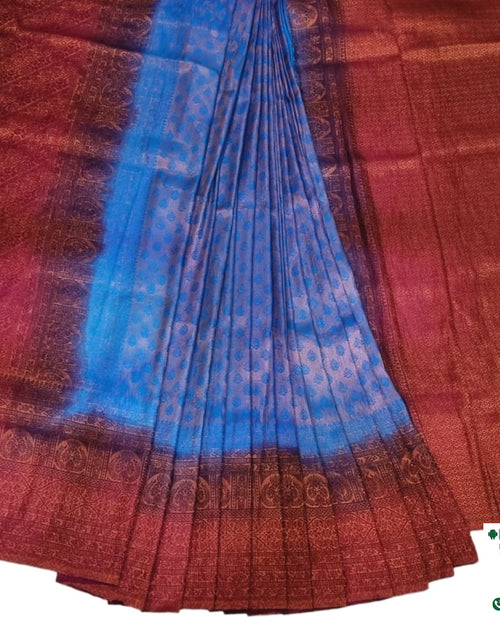 Soft Silk Saree With Blouse & With Stone Work, a pleated fabric with a bright blue center and red-toned patterned borders and ends