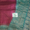 Soft Silk Saree With Blouse & With Stone Work, a purple and teal fabric featuring intricate patterns and metallic accents with tassels along the edge