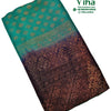 Soft Silk Saree With Blouse & With Stone Work, a folded teal and dark purple fabric with gold-toned woven patterns and embroidered dots