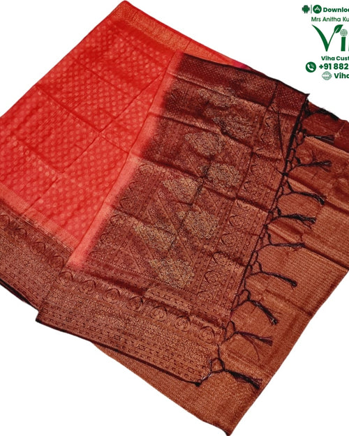 Soft Silk Saree With Blouse & With Stone Work, folded red fabric featuring intricate gold-toned woven patterns, borders, and hanging tassels