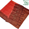 Soft Silk Saree With Blouse & With Stone Work, folded red fabric featuring intricate gold-toned woven patterns, borders, and hanging tassels