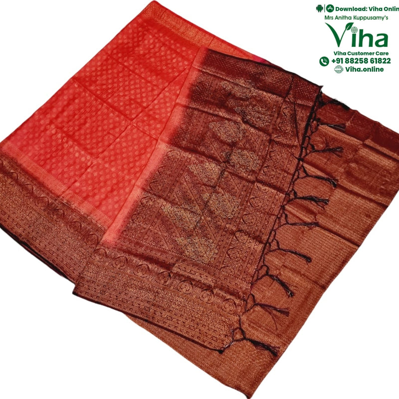 Soft Silk Saree With Blouse & With Stone Work, folded red fabric featuring intricate gold-toned woven patterns, borders, and hanging tassels