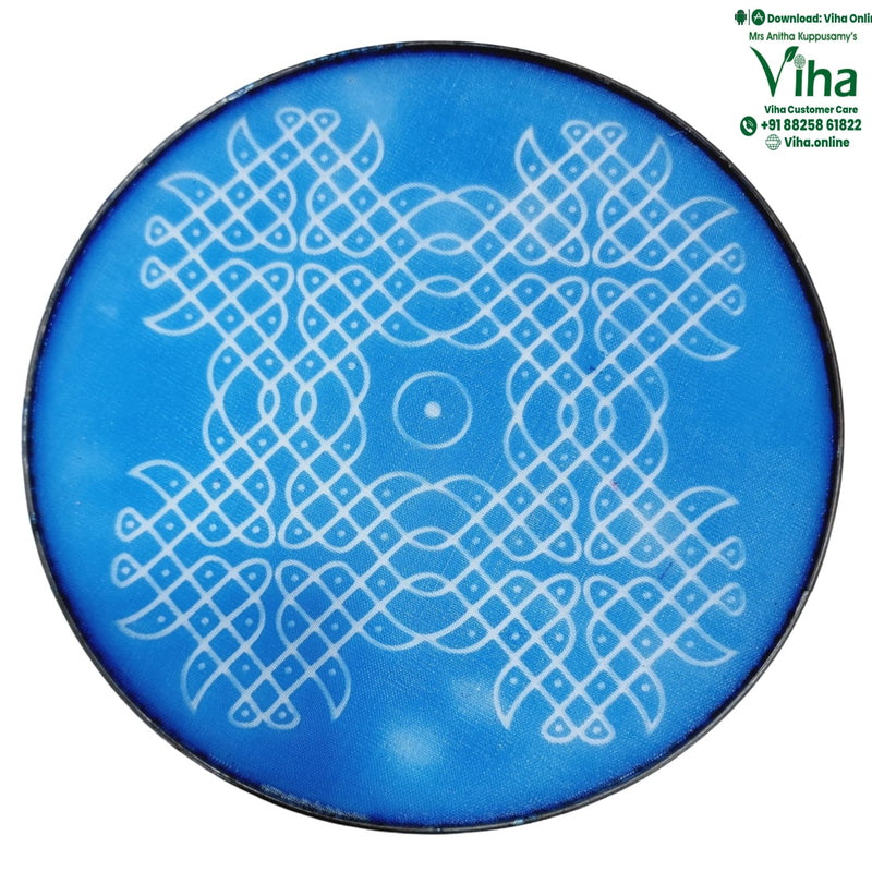 Rangoli Stencil Plate, a round blue plaque featuring a white interwoven geometric pattern with a central concentric circle and a thin dark border