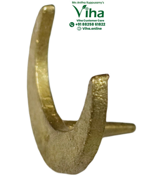 Chandra Bindi Stamp, a gold-toned crescent-shaped object with a textured surface and a single horizontal protrusion on its back