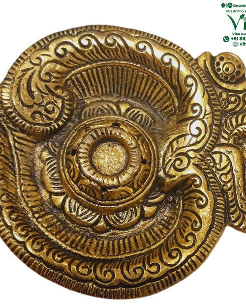 OM Shape Insence Holder, white metal plate with raised floral and scrollwork relief across the entire surface