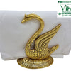 Duck Tissue Paper Holder, a gold-toned swan figurine with textured feathers stands on an oval base, holding a stack of white paper napkins