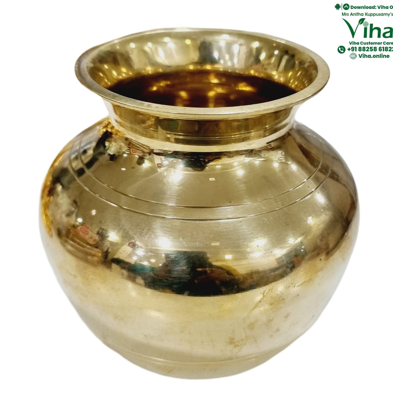 Heavy Lotta, squat brass vessel with horizontal ridge bands around the body, wide flared rim and short narrow neck
