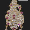 Impon Pendant in an animal figure shape with dangling elements and magenta stones