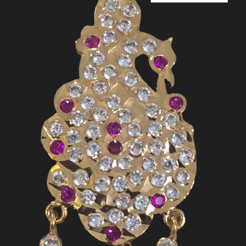 Impon Pendant in an animal figure shape with dangling elements and magenta stones