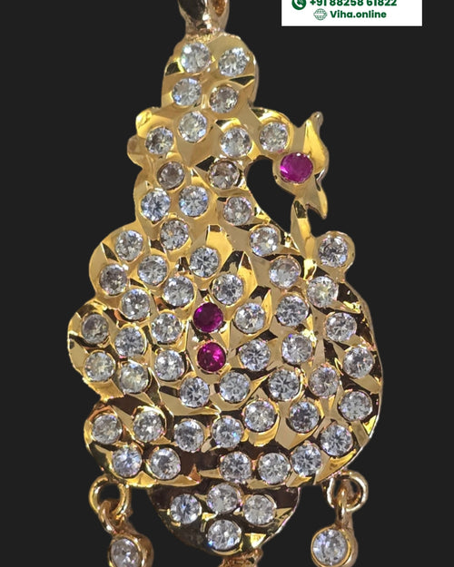 Impon Pendant, ornate, asymmetrical creature silhouette with a loop at the top and dangling charms at the bottom