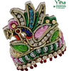 Idol Mukut, an ornate, multi-coloured embroidered brooch featuring clear stones, blue and pink elements, green stitching, and hanging beads