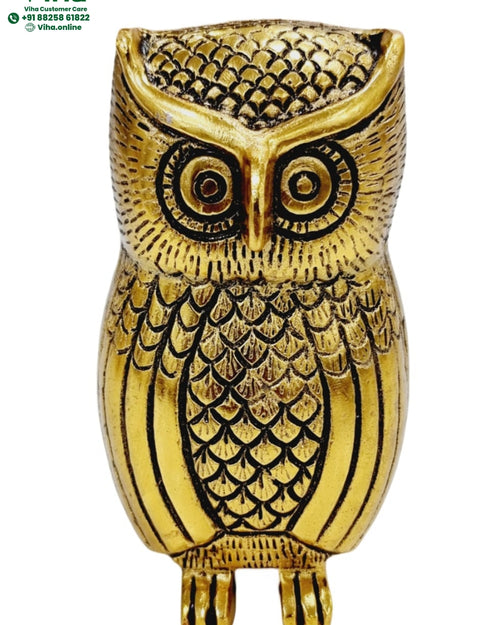 Owl statue, upright owl with large round eyes and scaled feather patterning, gold-polished finish
