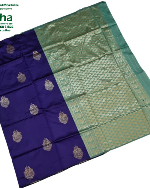 Soft Silk Saree with Blouse & with Grand Pallu, a folded blue and green textile with a gold-toned patterned section and ten embroidered motifs