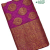 Banaras Semi Silk Saree, a folded pink fabric featuring gold-toned paisley motifs and a wide patterned border
