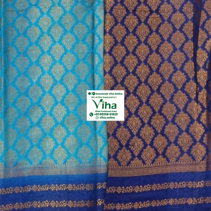 Soft Silk Saree with Blouse & with Grand Pallu, a folded textile with light blue and dark blue sections, featuring gold-toned woven repeating patterns